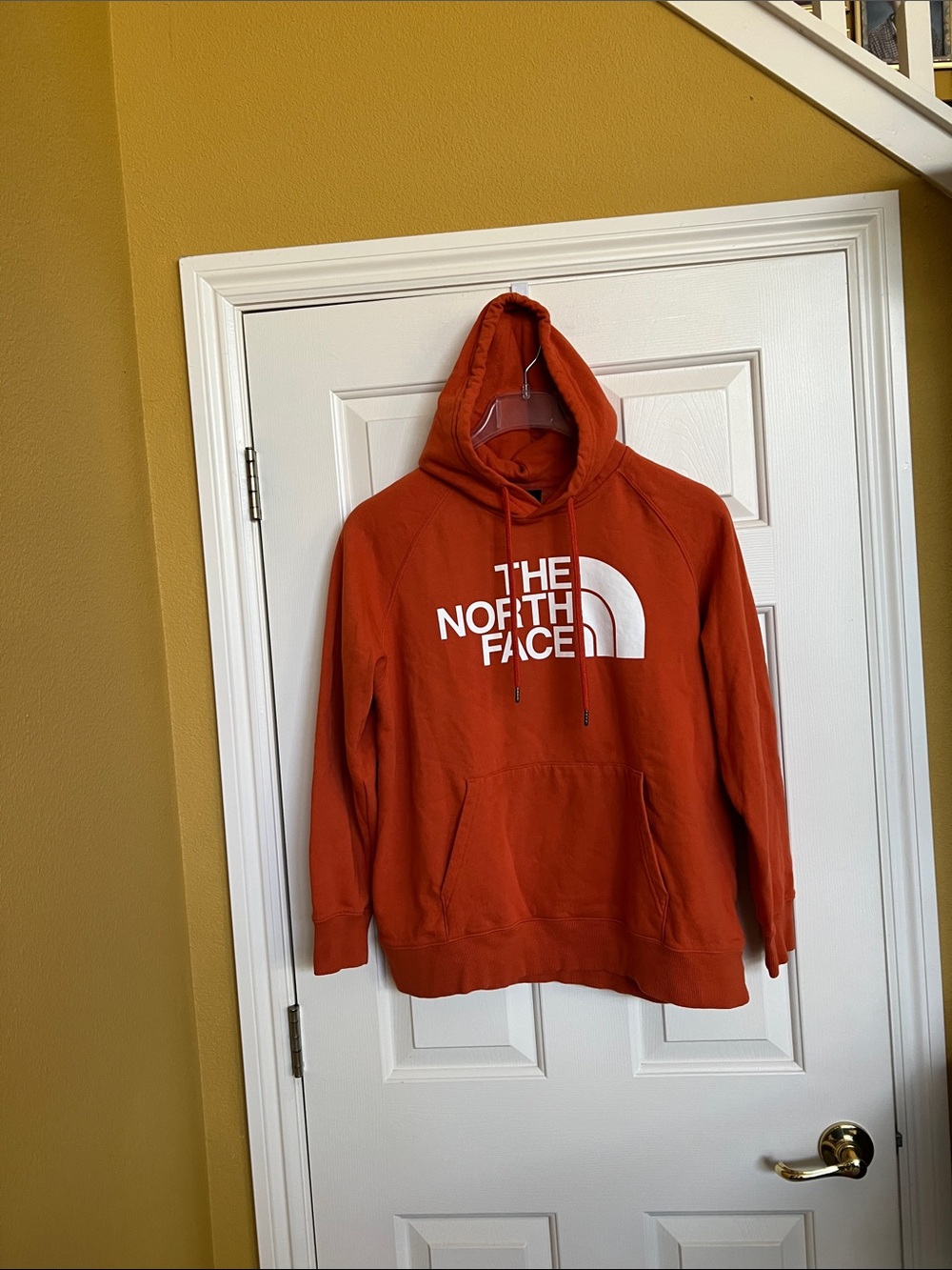 The North Face hoodie
 ( not bright orange )